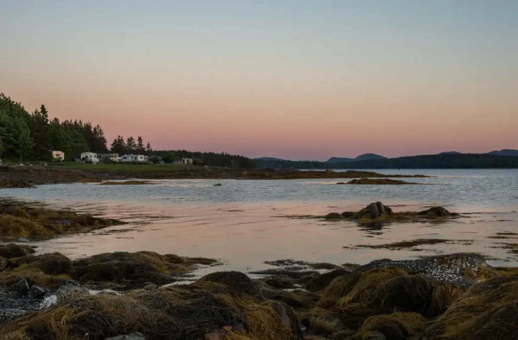 An RV campsite overlooking the Maine coast at sunset in Acadia National Park
