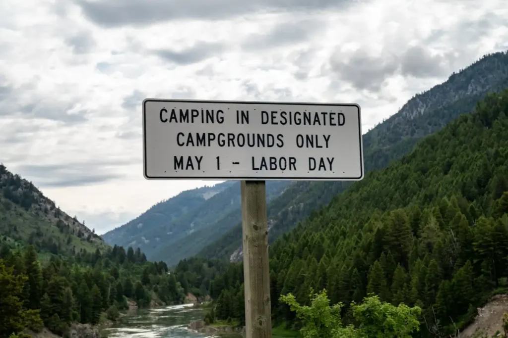 Roadside sign reading Camping in designated campgrounds only May 1 to Labor Day