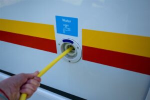 Fresh-water hose connected to an RV water inlet